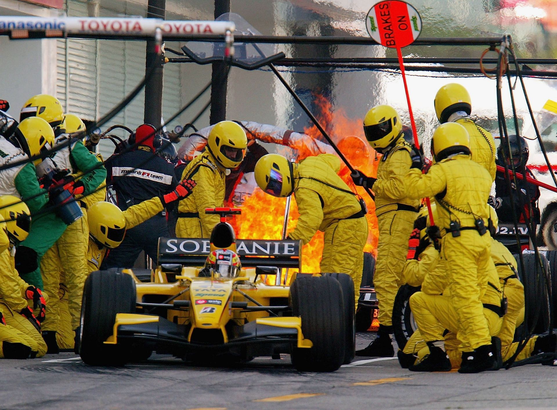 Race Driver Refuels at Pit Stop to Rejoin the Track