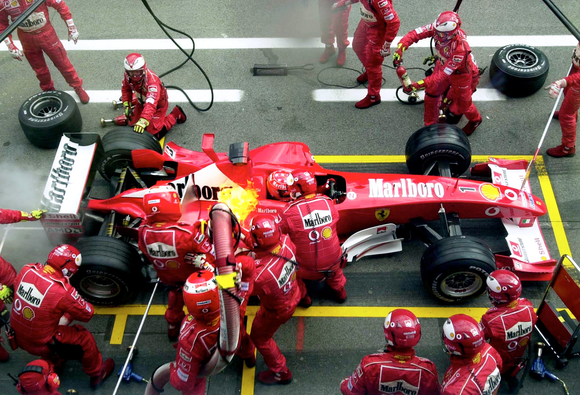 Race Driver Refuels at Pit Stop to Rejoin the Track
