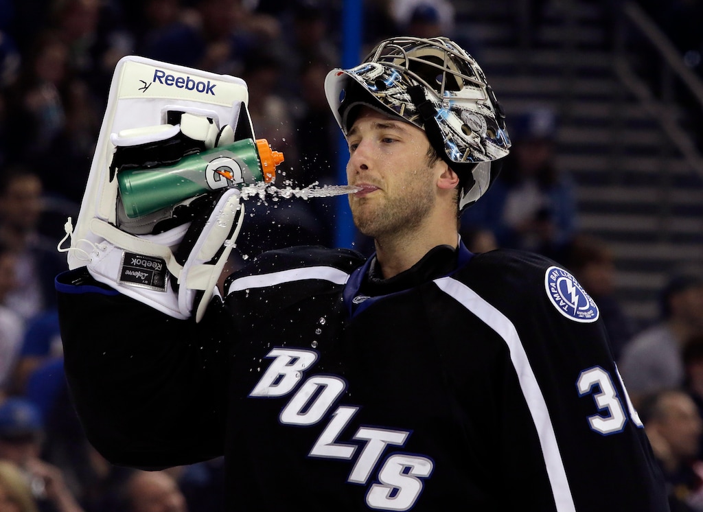 Why Do Hockey Players Spit: The Science Behind the Habit