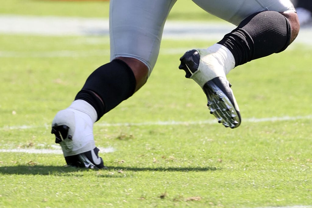 What cleats do NFL running backs wear? Discover the secrets to their performance!